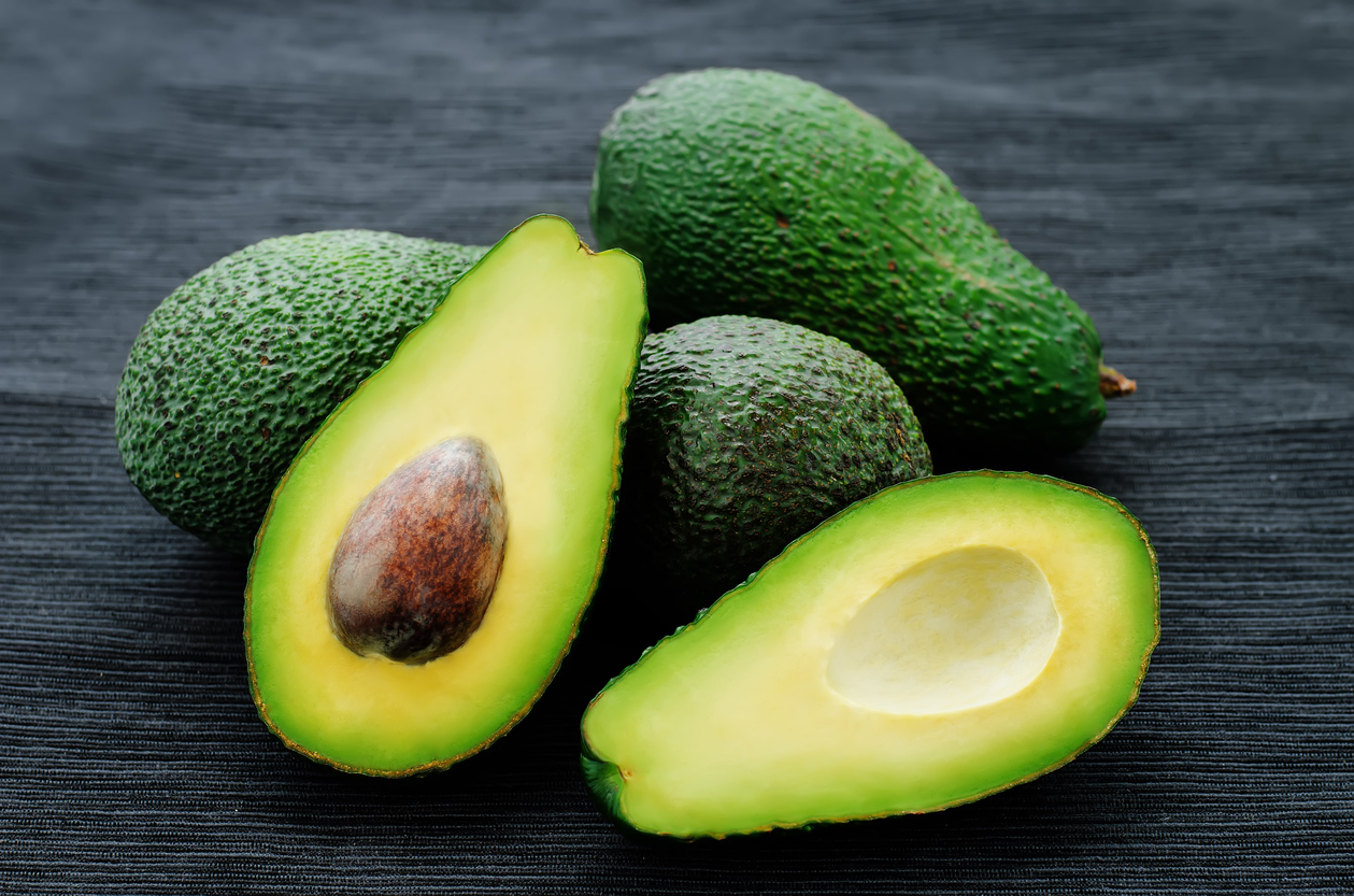 avocado on a black background. tinting. selective focus